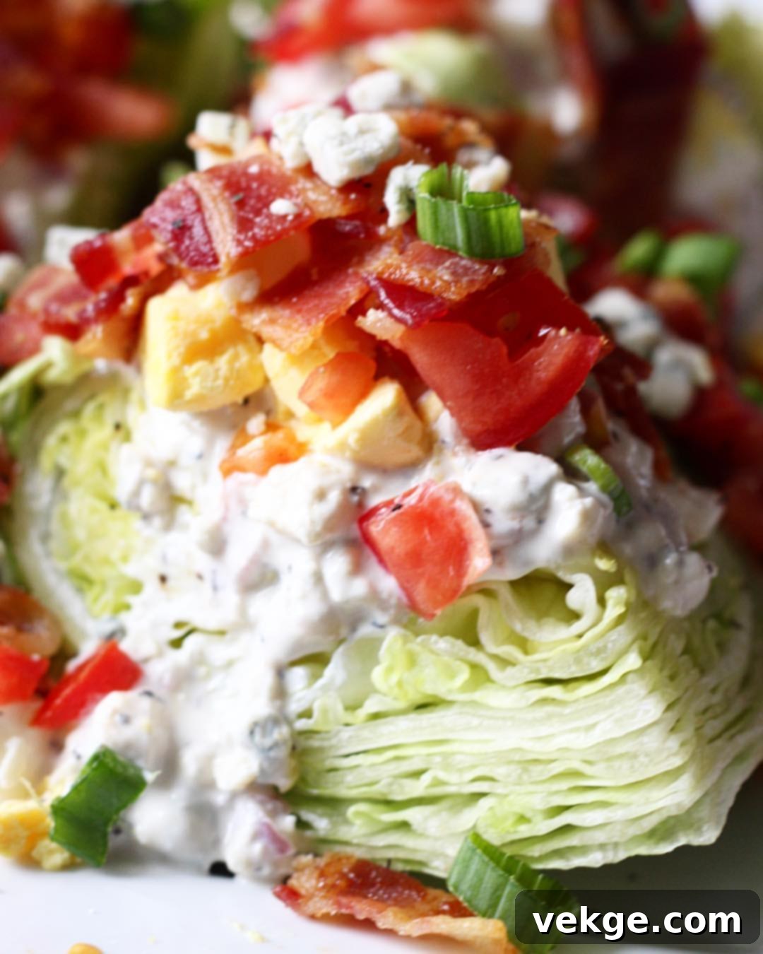 Crisp Wedge, Creamy Bleu 2 A beautifully presented Blue Cheese Wedge Salad with generous dressing and toppings