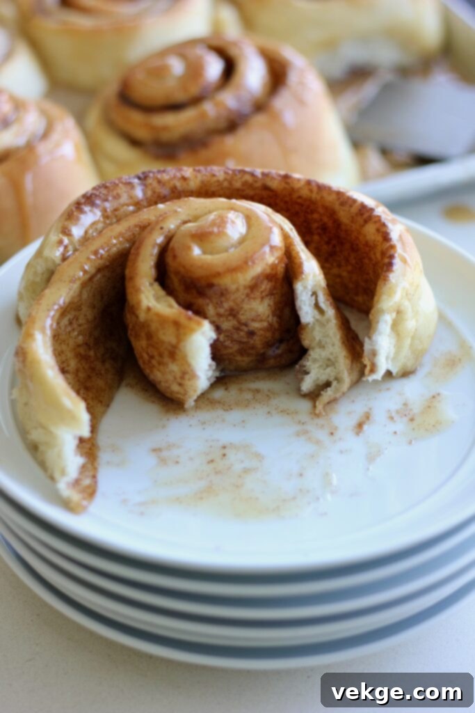 Giant Cinnamon Swirls with Golden Brown Butter Glaze 4 Cinnamon roll dough being rolled out
