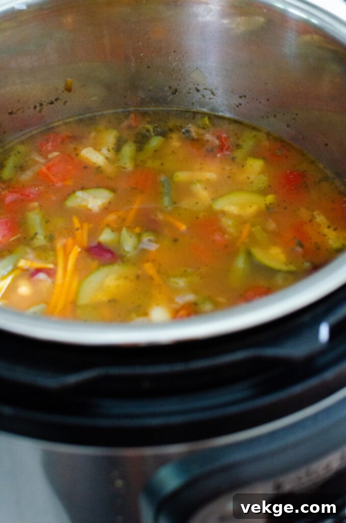 Effortless Instant Pot Minestrone 4 Various canned ingredients for Minestrone Soup, including diced tomatoes, kidney beans, and navy beans, showcasing pantry staples.