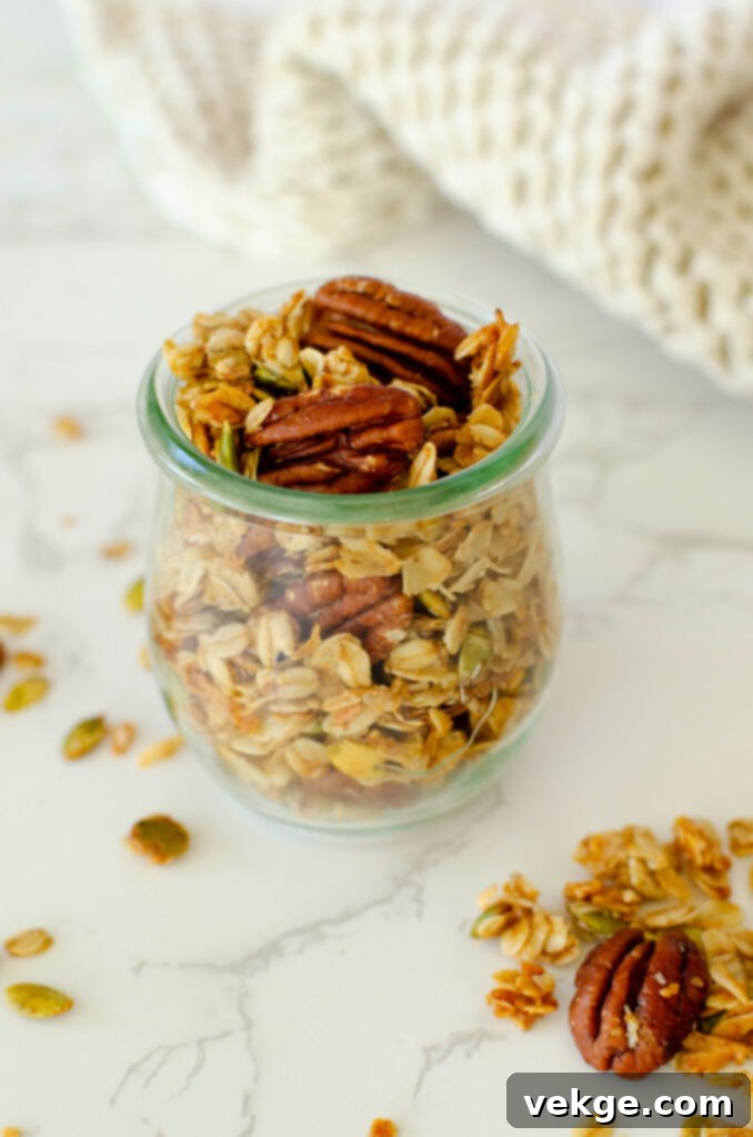 Cozy Cinnamon Granola 2 Close-up of golden brown homemade cinnamon granola with nuts and seeds