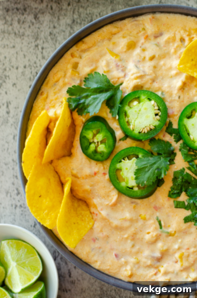 Ingredients for Creamy Corn Queso Dip arranged on a cutting board
