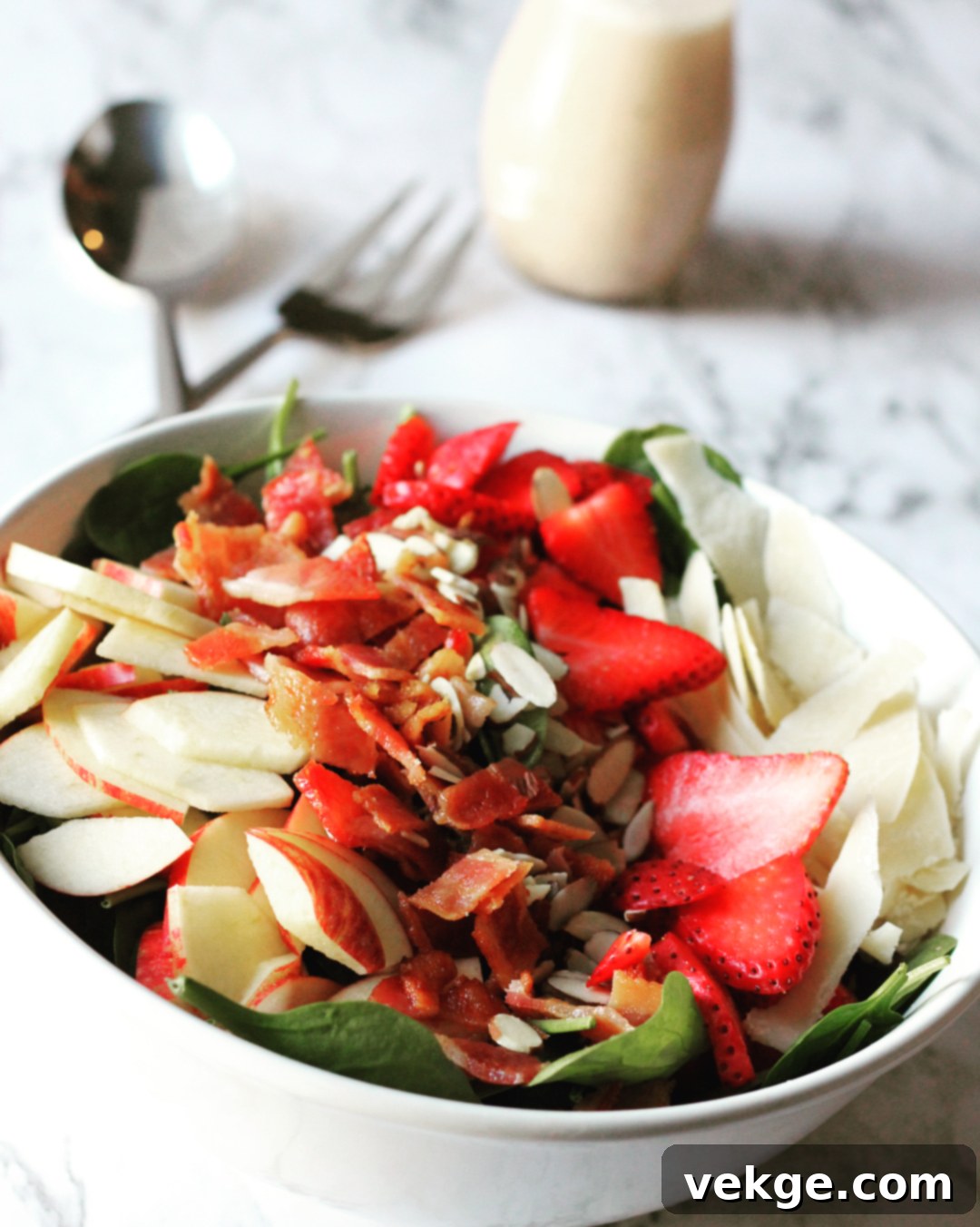 Crisp Apple, Smoky Bacon Salad 2 Freshly prepared Apple Bacon Salad on a rustic wooden table, showcasing vibrant colors and fresh ingredients.