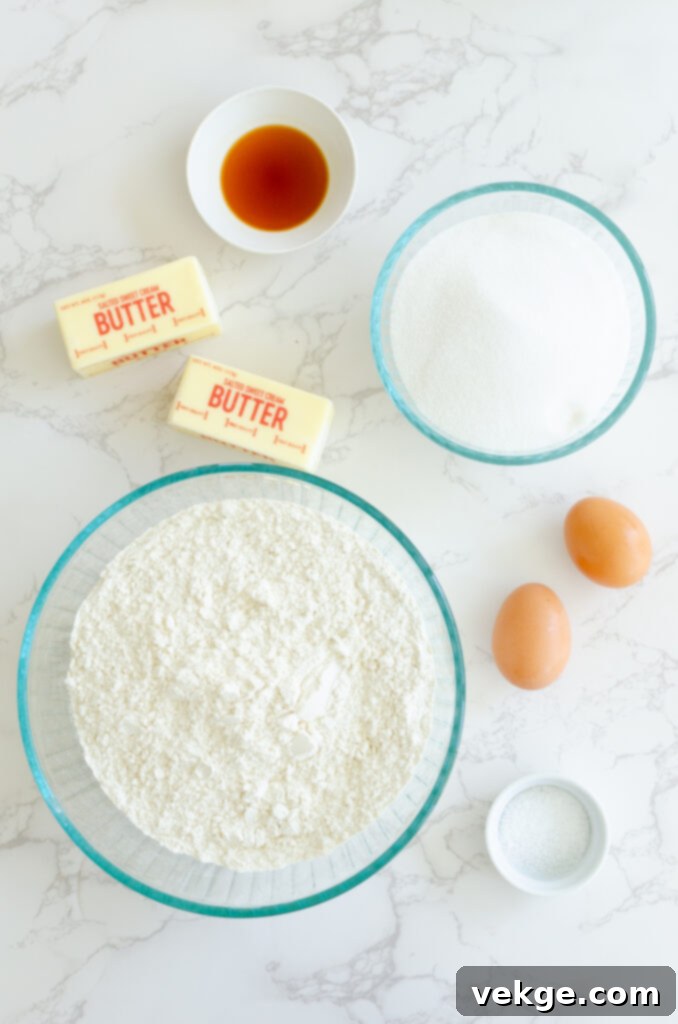 Instant Sugar Cookies 2 Freshly baked sugar cookies with white frosting on a cooling rack.