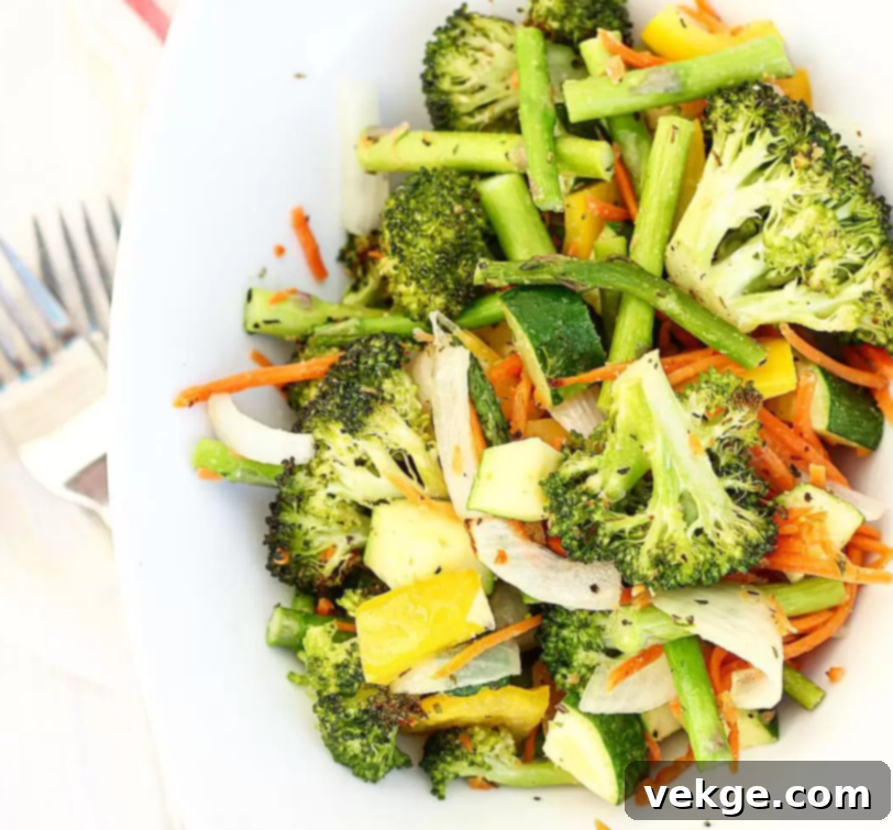 A colorful medley of roasted vegetables on a plate, ready to be served.