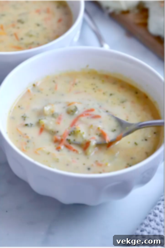 Creamy Broccoli Cheddar Delight 2 A large, steaming pot of creamy broccoli cheese soup, ready to be served on a cold day.