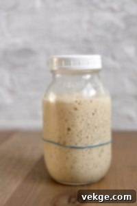 Intricate Six-Strand Bread 3 Close-up of dough ropes ready for braiding.