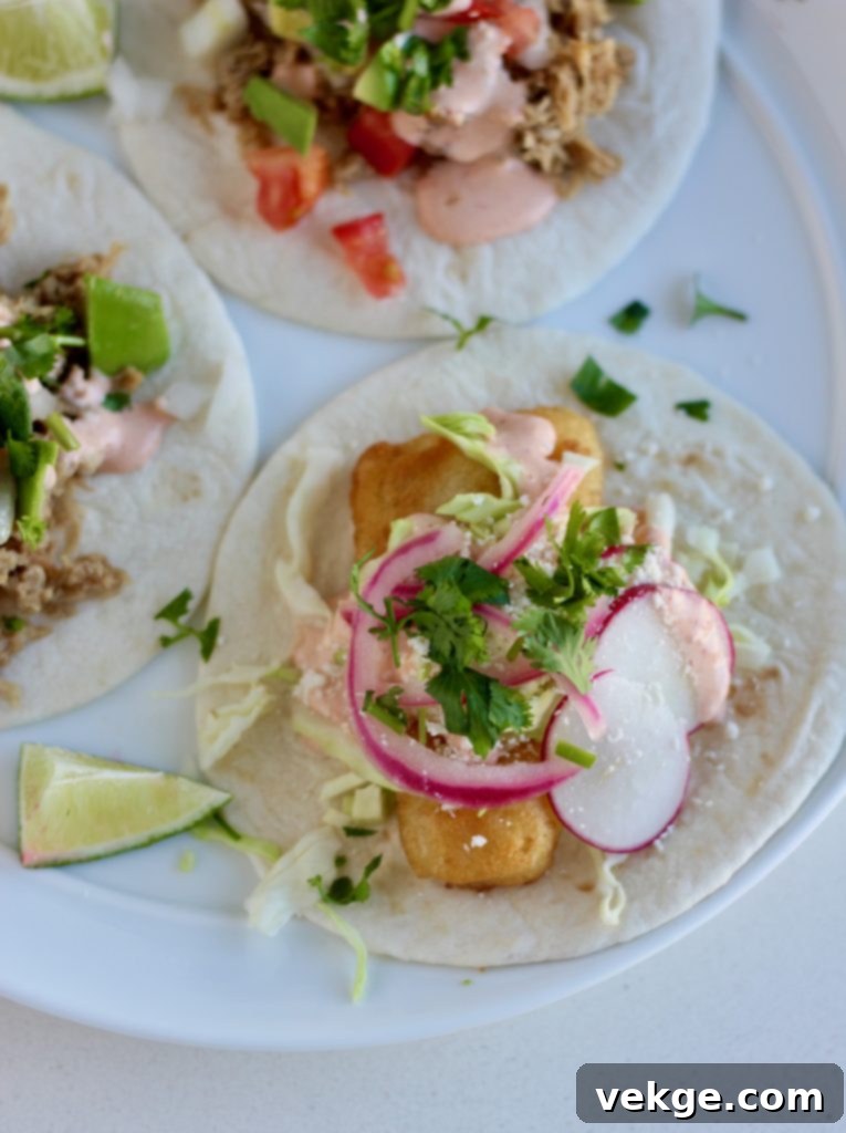 Tangy Onion Delights 3 Close-up of vibrant pink pickled red onions in a glass jar, showcasing their beautiful color and crisp texture