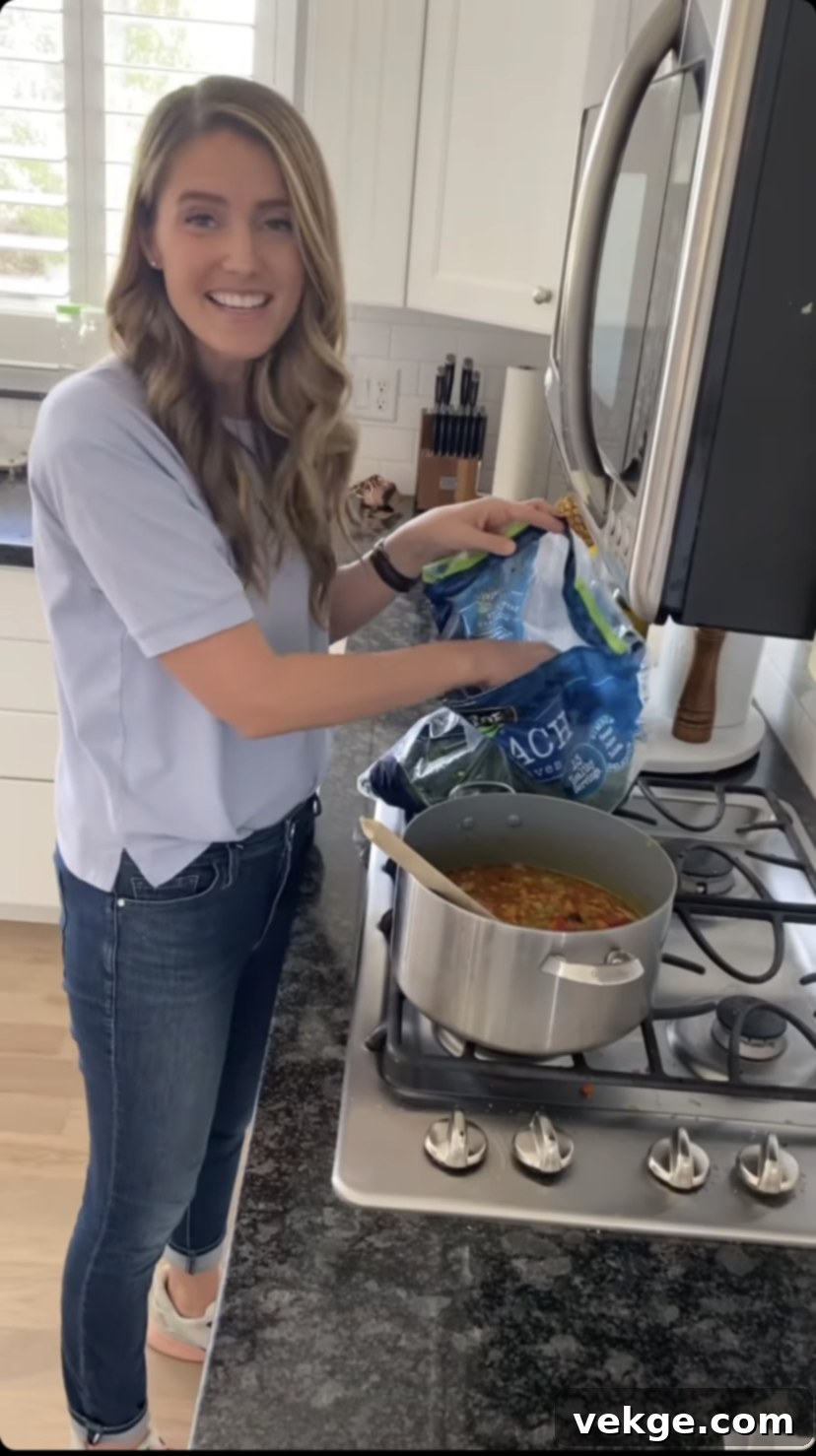 Monday's Comfort Bowl 3 A close-up of fresh, vibrant ingredients for Monday Soup, including chopped carrots, celery, and onion.