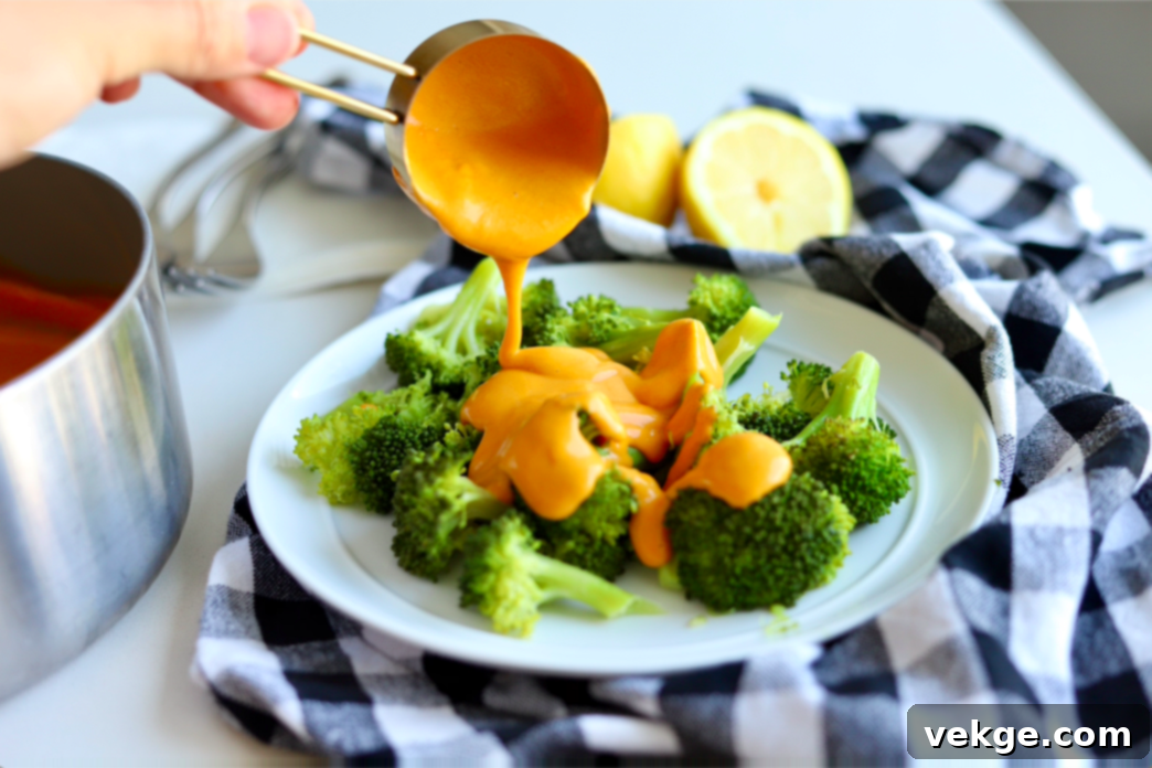 Creamy Vegan Cheese Sauce 3 A close-up shot emphasizing the smooth and golden texture of the finished vegan cheese sauce in a bowl.