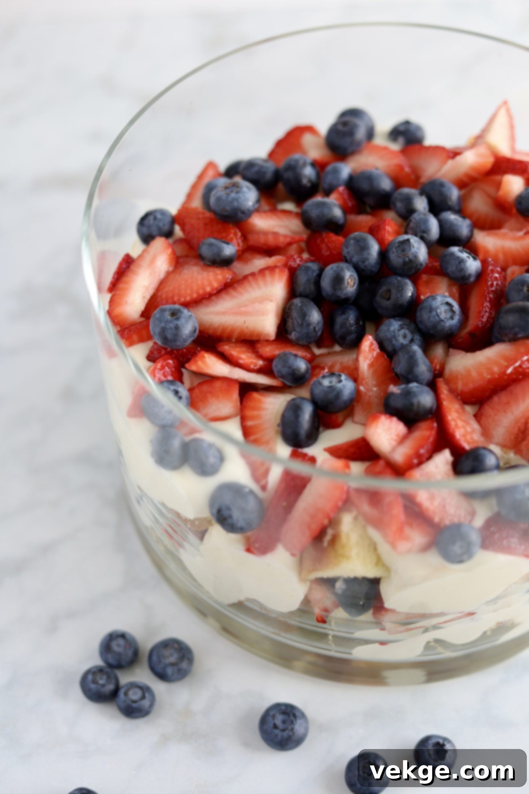 Berry Medley Trifle 3 A close-up of fresh, juicy berries used in the trifle, including strawberries, blueberries, and raspberries.