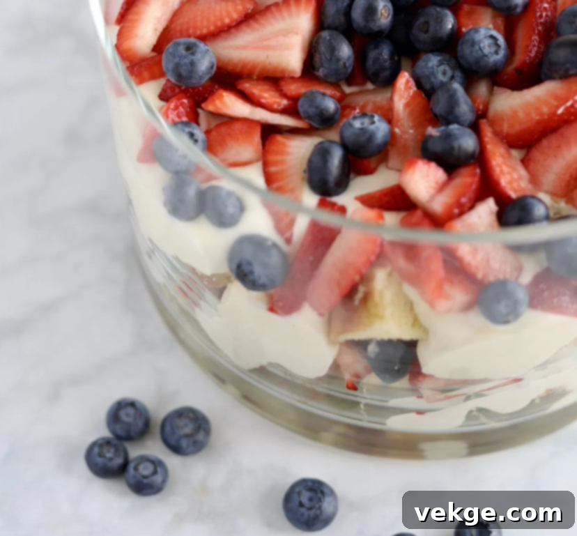 Berry Medley Trifle 4 A beautifully layered berry trifle with homemade pudding and whipped cream, ready to be served.