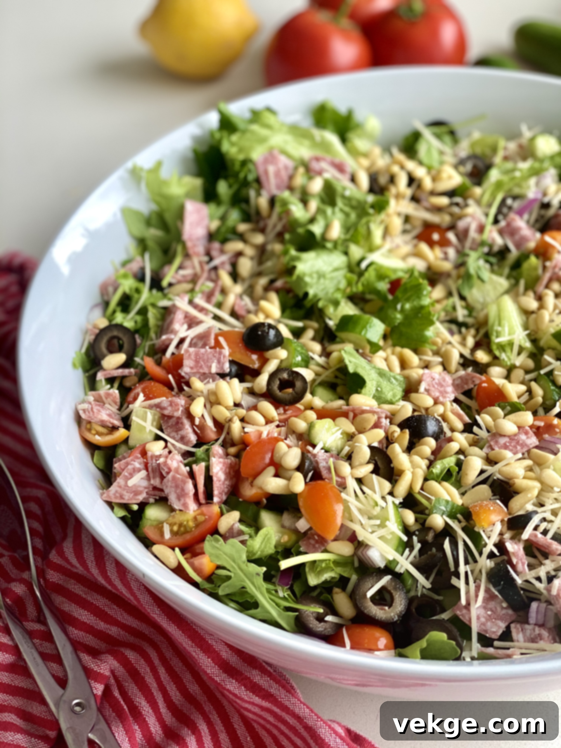 Vibrant Italian Salad 2 A beautifully presented Fresh Italian Salad with vibrant vegetables, salami, and cheese, ready to be dressed.