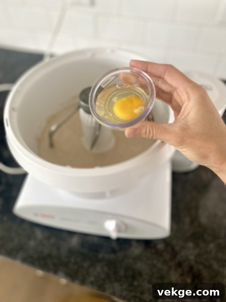 Artisan Burger Buns 8 Dough being kneaded in a stand mixer.