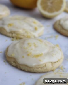 Sunshine Lemon Delights by Kate 3 A stack of golden-brown lemon cookies, perfectly round and ready for frosting.