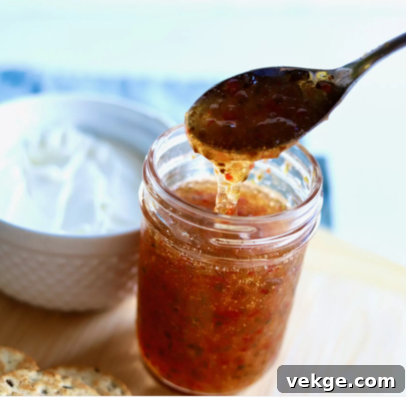 Sweet Heat Jalapeño Jelly 4 Close-up of a jar of bright green Jalapeño Jelly