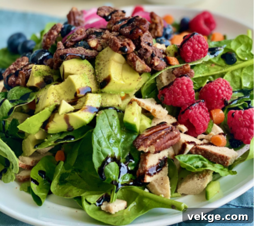 Delicious and healthy Spinach Berry Salad with homemade dressing.