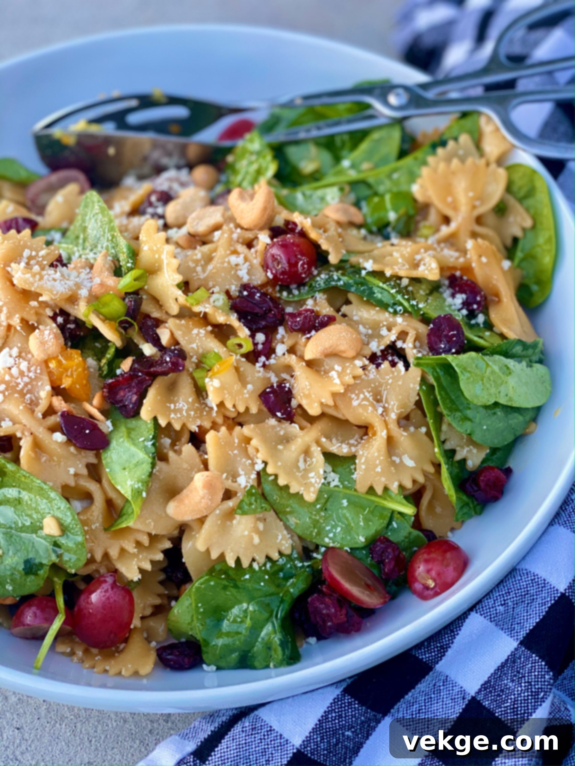 Zesty Pasta Toss 2 Freshly made pasta salad with bow tie pasta, spinach, oranges, and cranberries