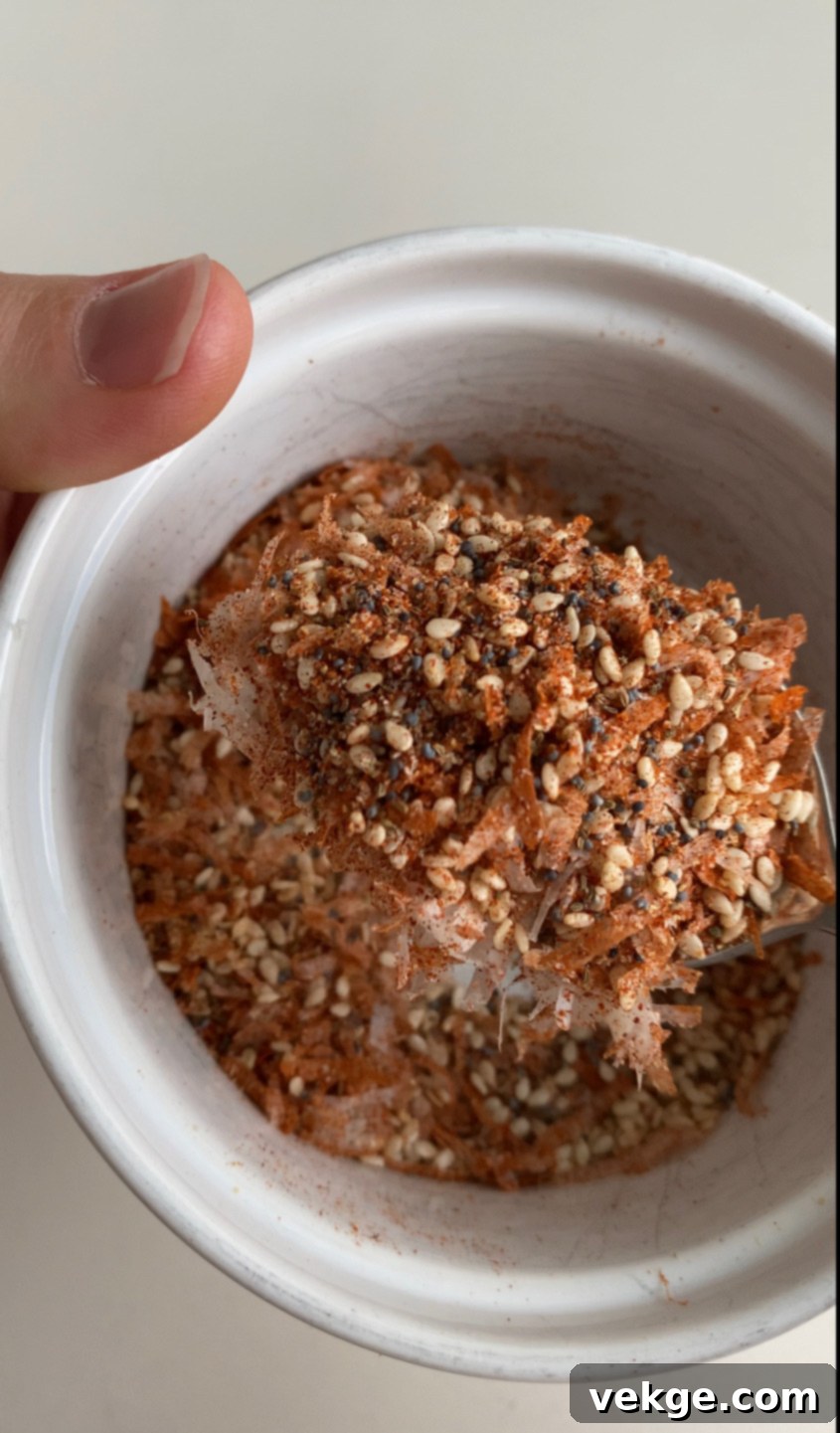 Ultimate Homemade Salad Blend 3 Ingredients for Salad Supreme blend laid out on a clean surface, including various seeds and spices.