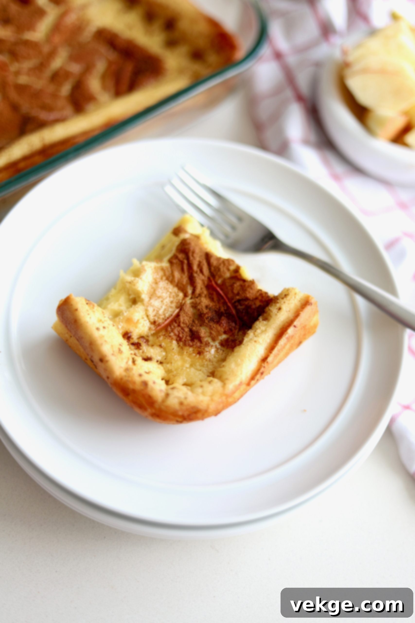 Sourdough German Oven Puff 2 Golden brown Sourdough German Pancakes, puffy and lightly browned on the edges, fresh from the oven, ready to be served for breakfast or brunch.