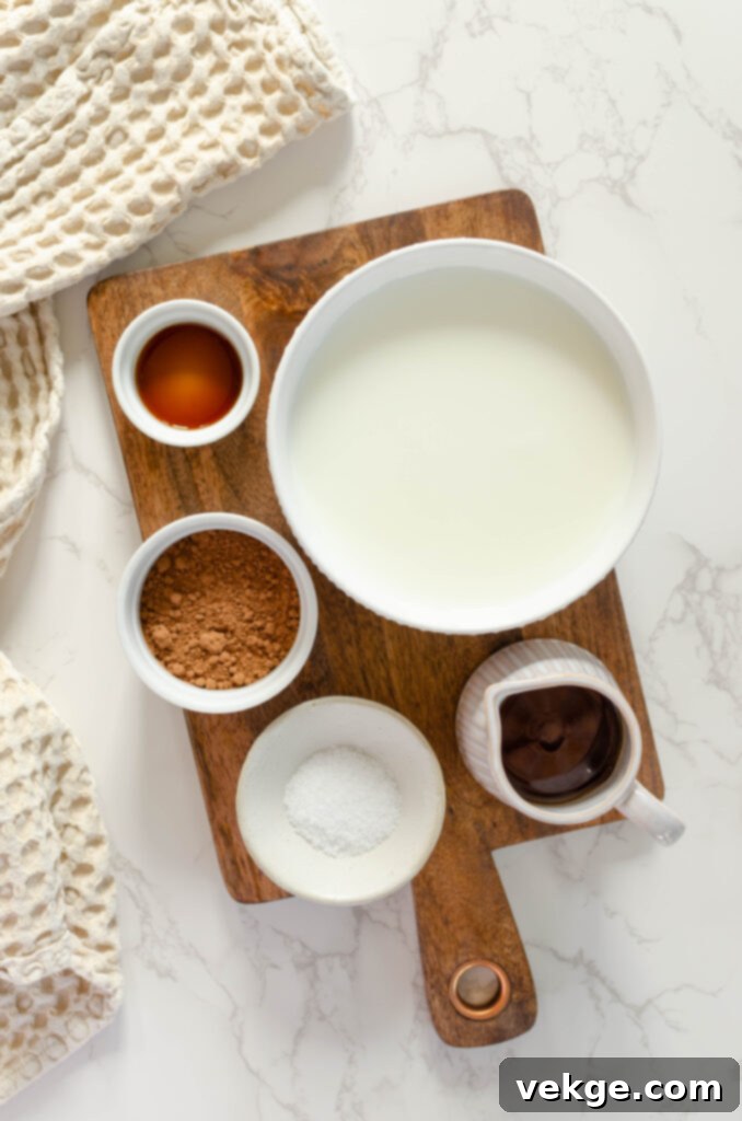 Freshly prepared hot chocolate simmering gently in a saucepan on the stove.