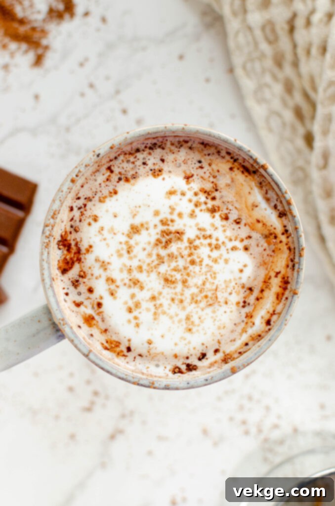 A small bowl of Redmond Real Salt, essential for enhancing the flavor of hot chocolate.