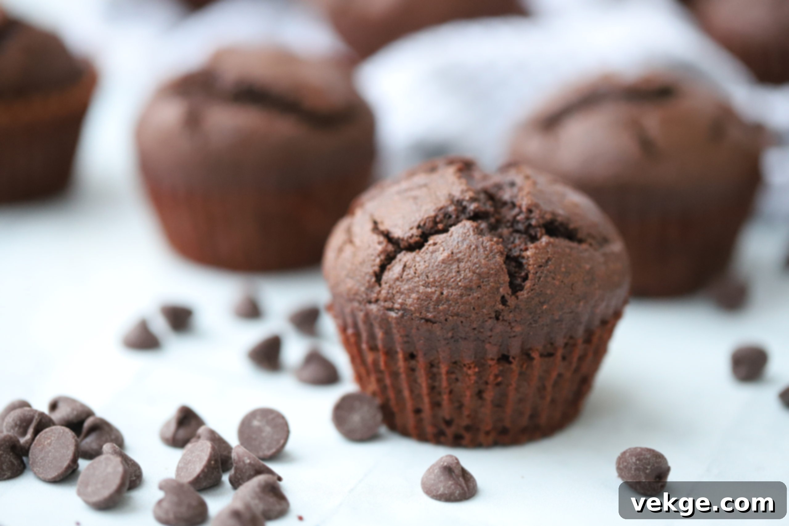 Perfectly Moist Chocolate Banana Muffins 2 Delicious, golden-brown chocolate banana muffins cooling on a wire rack, ready to be enjoyed.