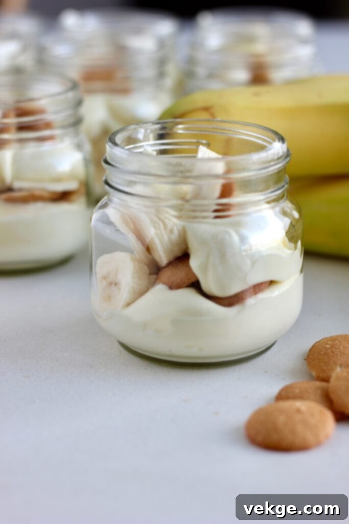 Close-up of a perfectly layered banana pudding cup
