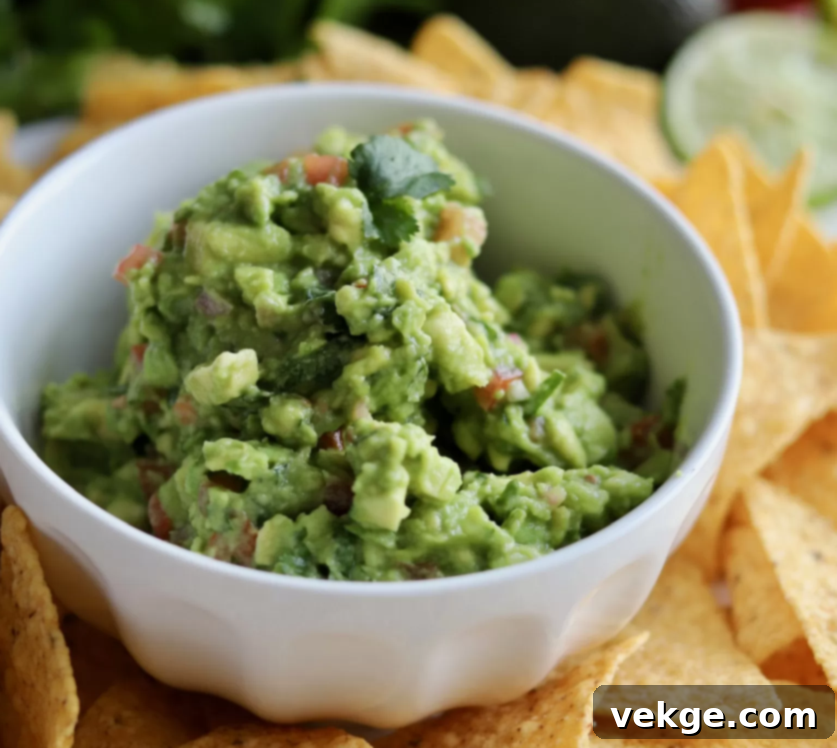 Close-up of a bowl of freshly made guacamole with tortilla chips