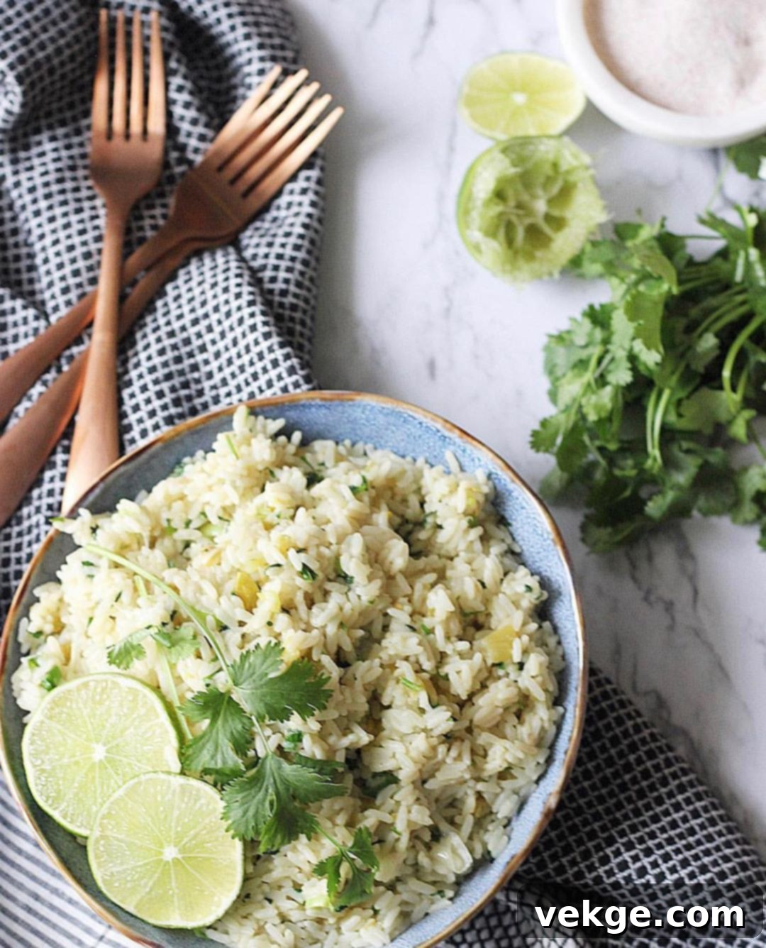 Cilantro Lime Rice 2 Freshly cooked cilantro lime rice in a bowl, garnished with more cilantro and a lime wedge