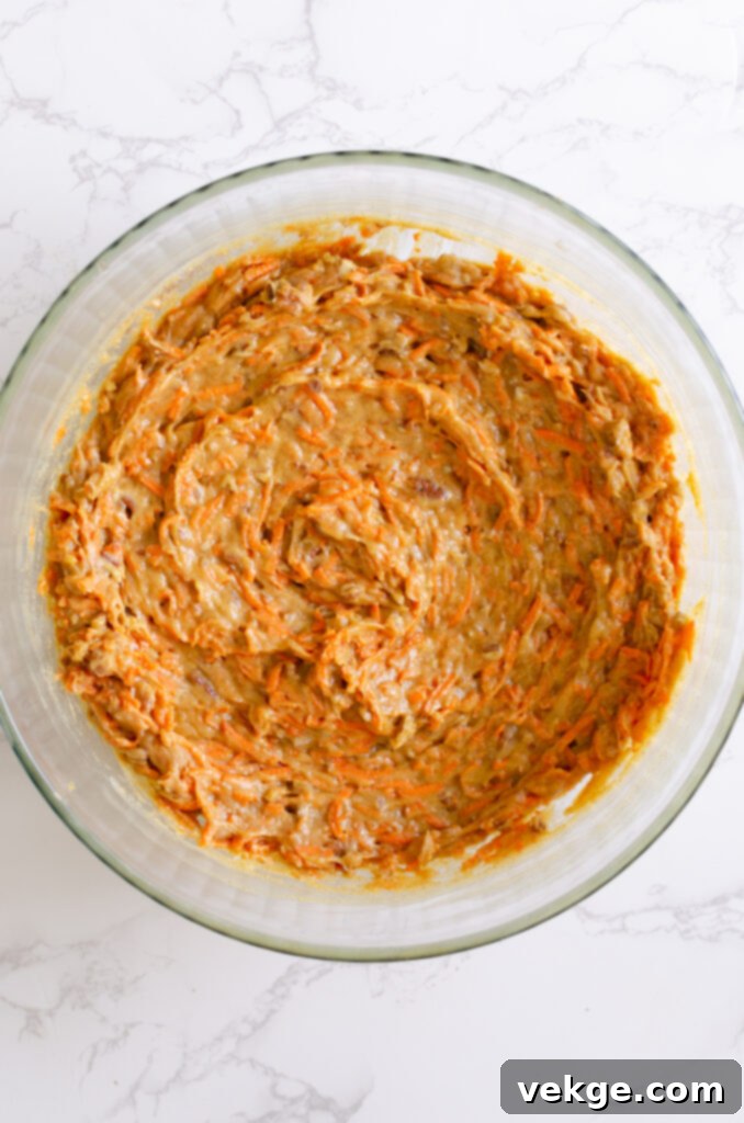 Mixing bowl with eggs and oil for carrot cake batter