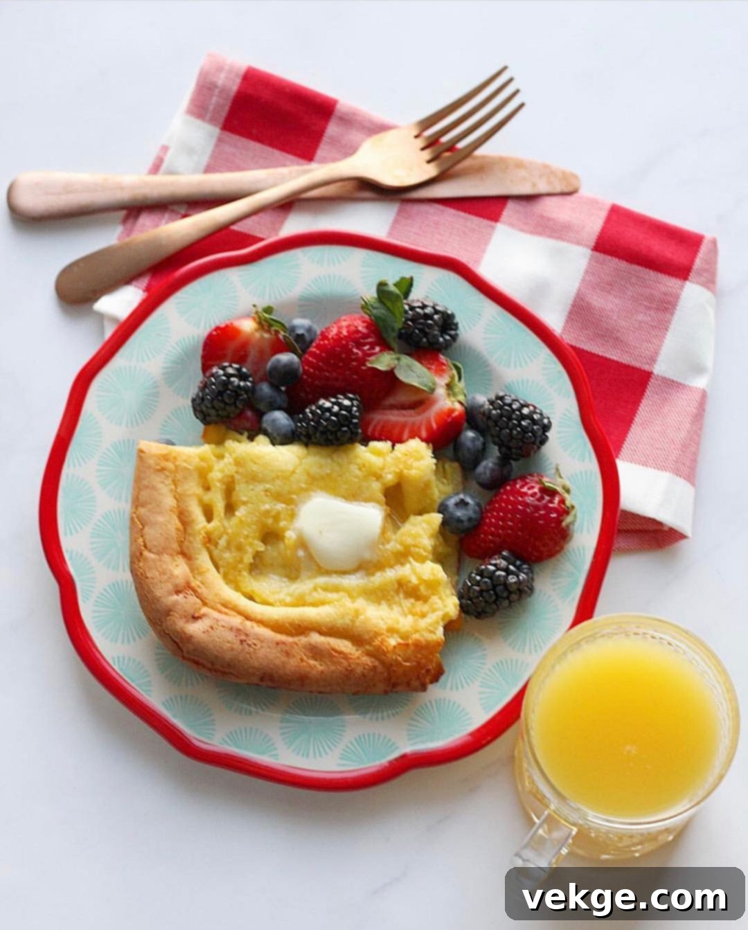 Oven-Baked German Delights 2 Golden brown German pancake fresh out of the oven, puffed up and ready to be served. It's a delightful, easy breakfast.