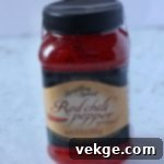 Sweet Heat Cheese Board 4 A box of artisan rosemary crackers, emphasizing their quality and herbaceous flavor.