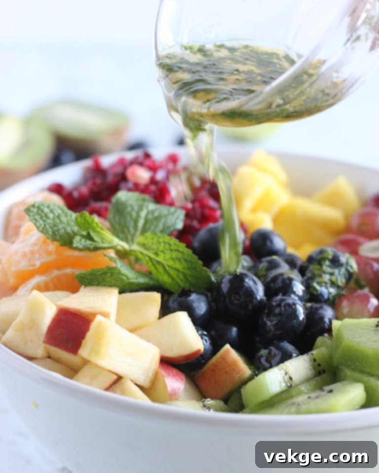 Mixing the fruit salad with dressing