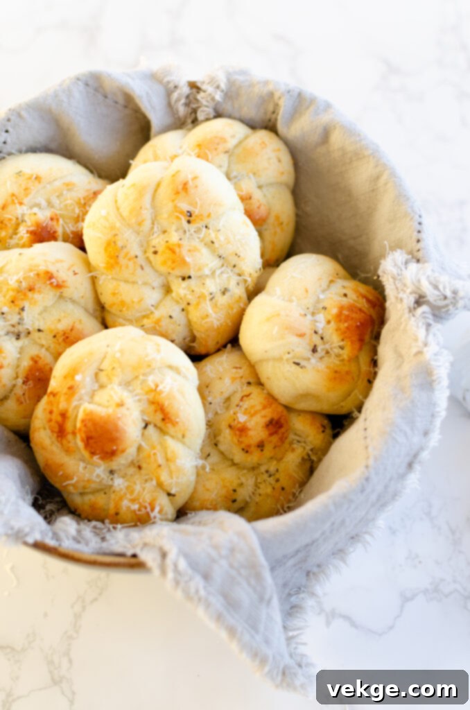Irresistible Garlic Parmesan Knots 9 garlic parmesan knots on a serving plate