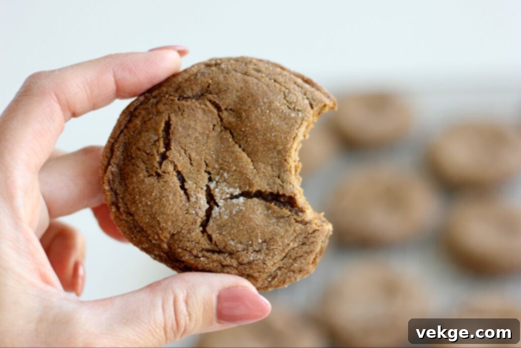 Chewy Ginger Molasses Cookies 3 Measuring cup filled with dark brown sugar, an essential ingredient for rich ginger spice cookies