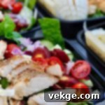 Several meal prep salads lined up