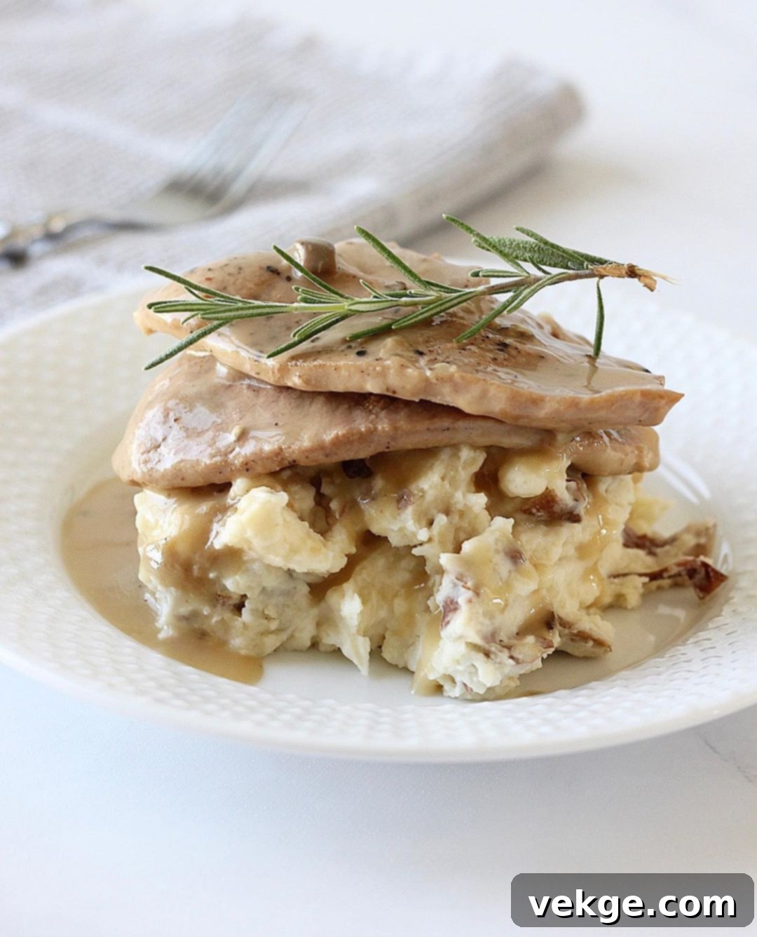 Slow Cooker Pork Chops with Creamy Mashed Potatoes 3 Close-up of Crockpot Pork Chops with gravy and a side of creamy mashed potatoes