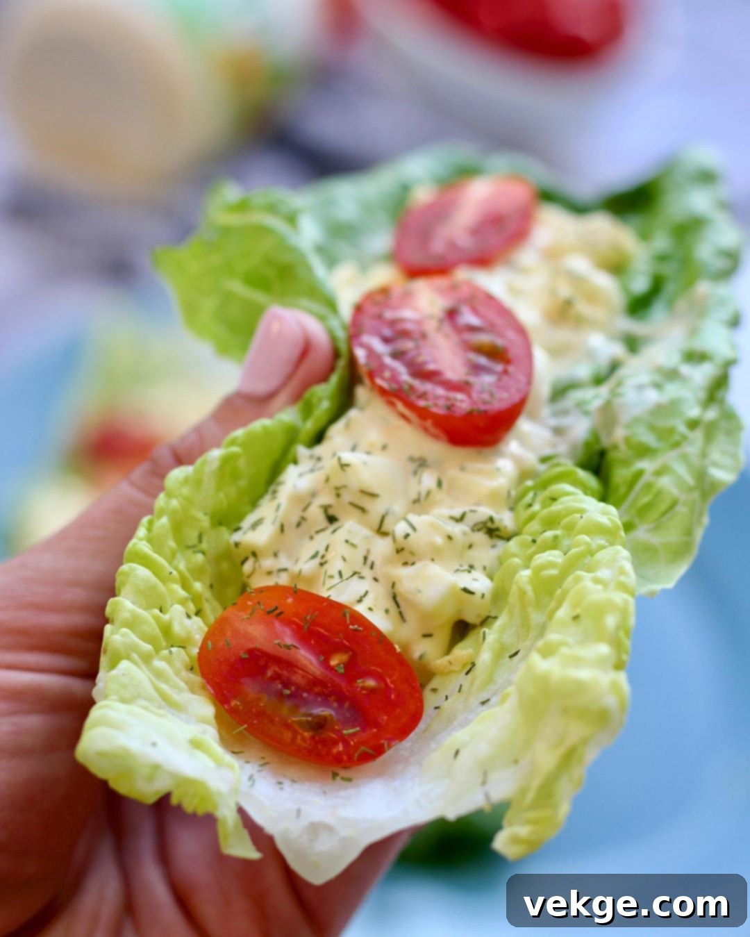 Perfect Egg Salad 3 A serving of healthy egg salad on a slice of toasted bread, garnished with fresh dill.