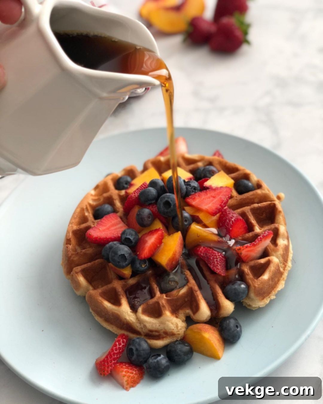 Artisan Sourdough Waffles 2 Crispy golden sourdough waffles served with fresh berries and maple syrup