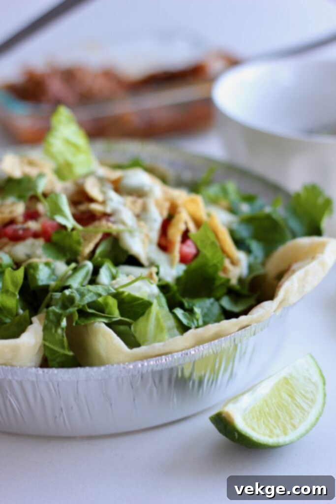 Sweet Pork Perfection Cafe Rio Style 6 A colorful Cafe Rio salad bowl with sweet pork, rice, beans, and fresh toppings