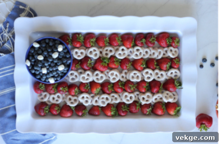 Patriotic Party Bites 4 Beautifully arranged Patriotic Fruit Skewers, a delightful and healthy 4th of July snack.