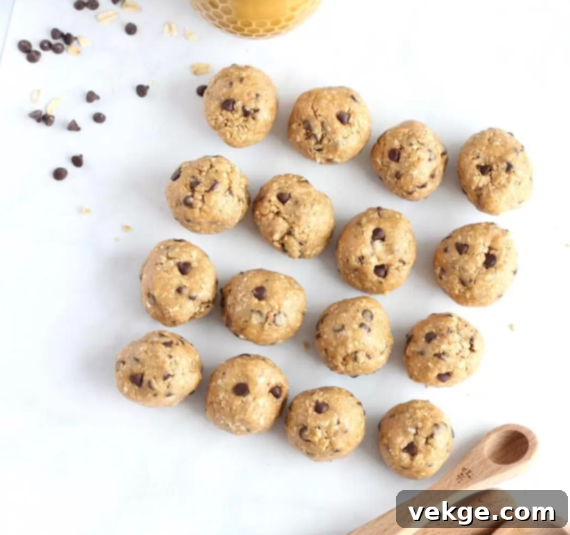 A bowl of freshly made Peanut Butter Chocolate Chip Cookie Dough Balls, highlighting the rich colors and inviting texture.
