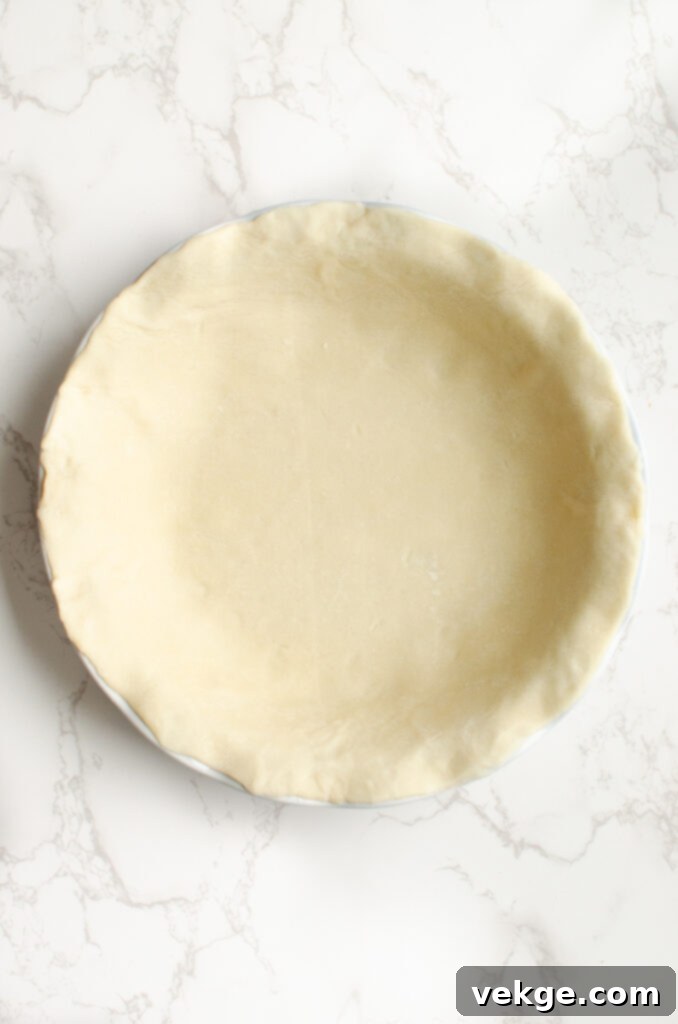 Ultimate Weeknight Chicken Pot Pie 6 Lining pie pans with crust