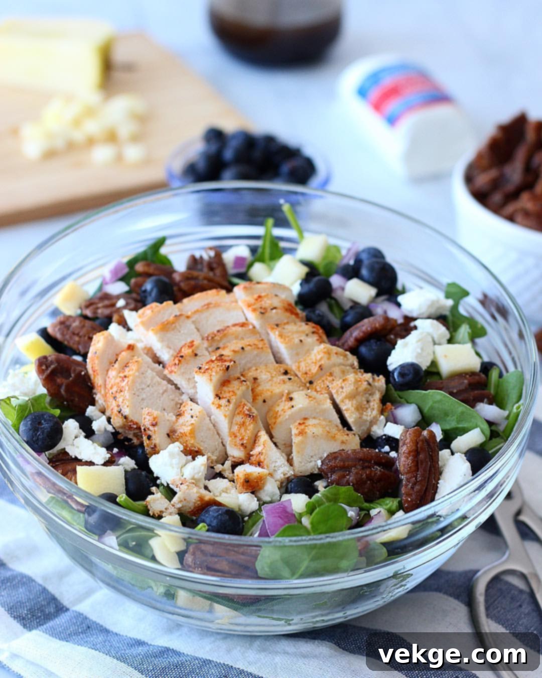 Effortless Luncheon Salads 2 A vibrant and colorful Luncheon Salad, featuring fresh greens, cooked chicken, blueberries, diced apples, and a light vinaigrette.