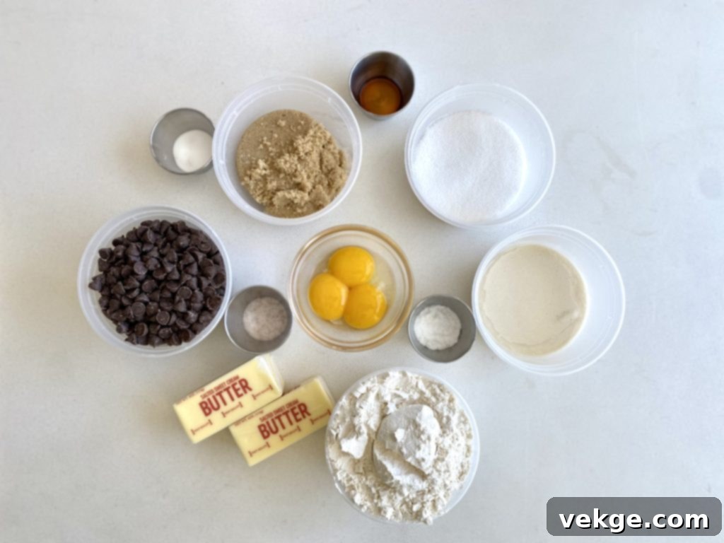 Close-up of baked sourdough chocolate chip cookies on a cooling rack.