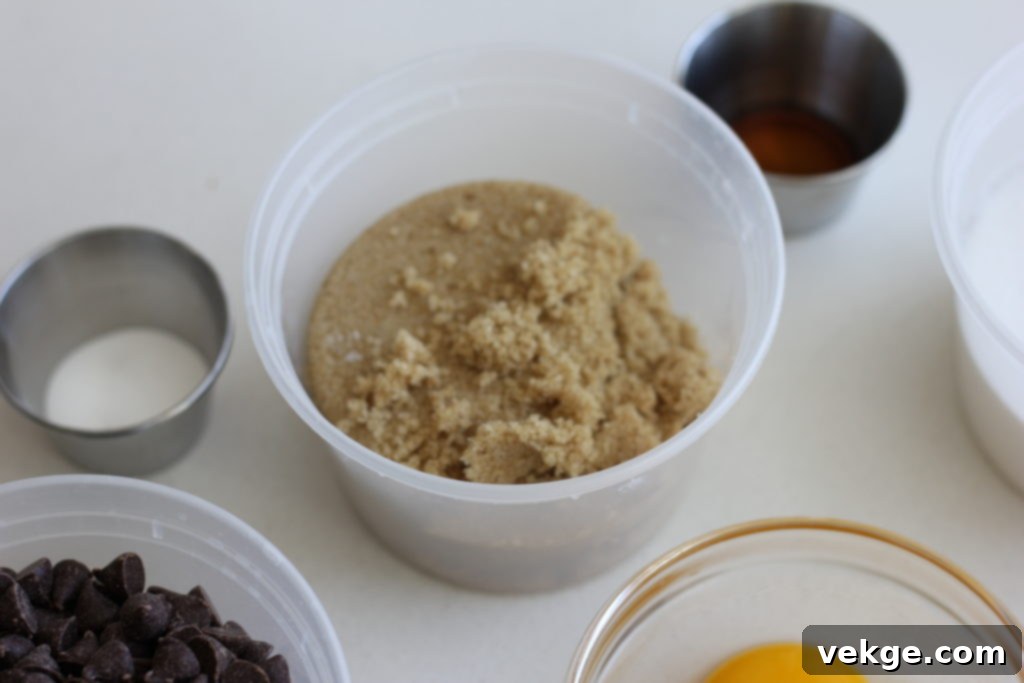 Brown sugar and white sugar in measuring cups.