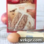 Golden Harvest Cookie Delights 3 Bowl of cookie dough made from a spice cake mix, with a wooden spoon, ready for baking delicious fall cookies.