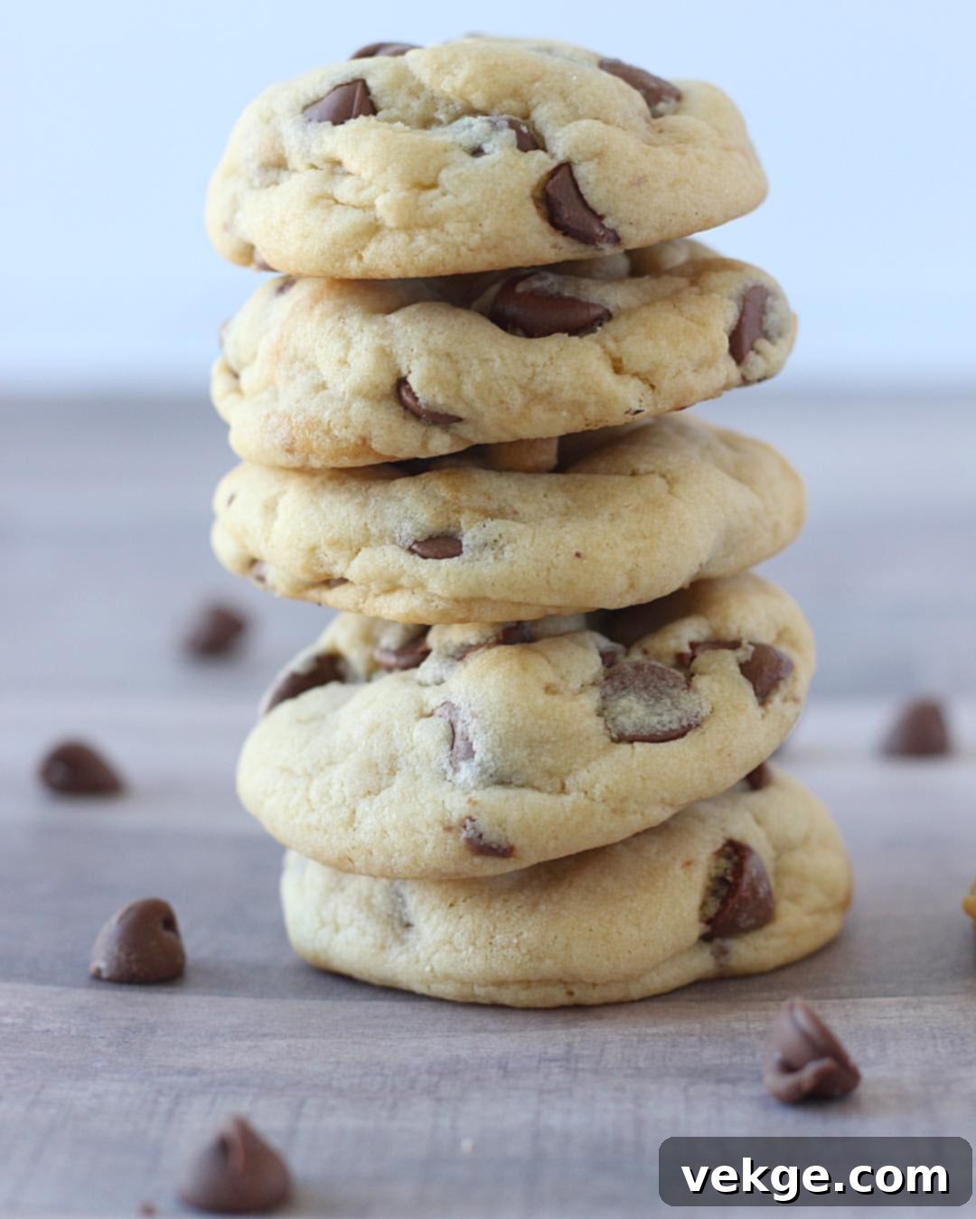 Melt-in-Your-Mouth Chocolate Chip Cookies 2 A stack of perfectly baked, incredibly soft chocolate chip cookies, garnished with chocolate chips.