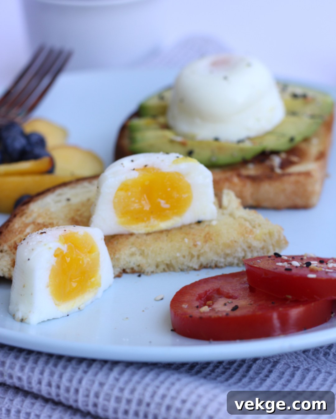 Perfectly poached eggs removed from the mold, with set whites and soft yolks