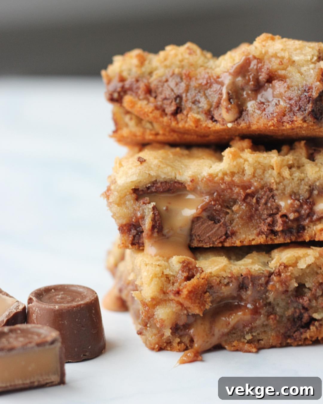 Golden Rolo Caramel Blondies 3 Overhead shot of Rolo Stuffed Blondies cut into neat squares in a baking dish.